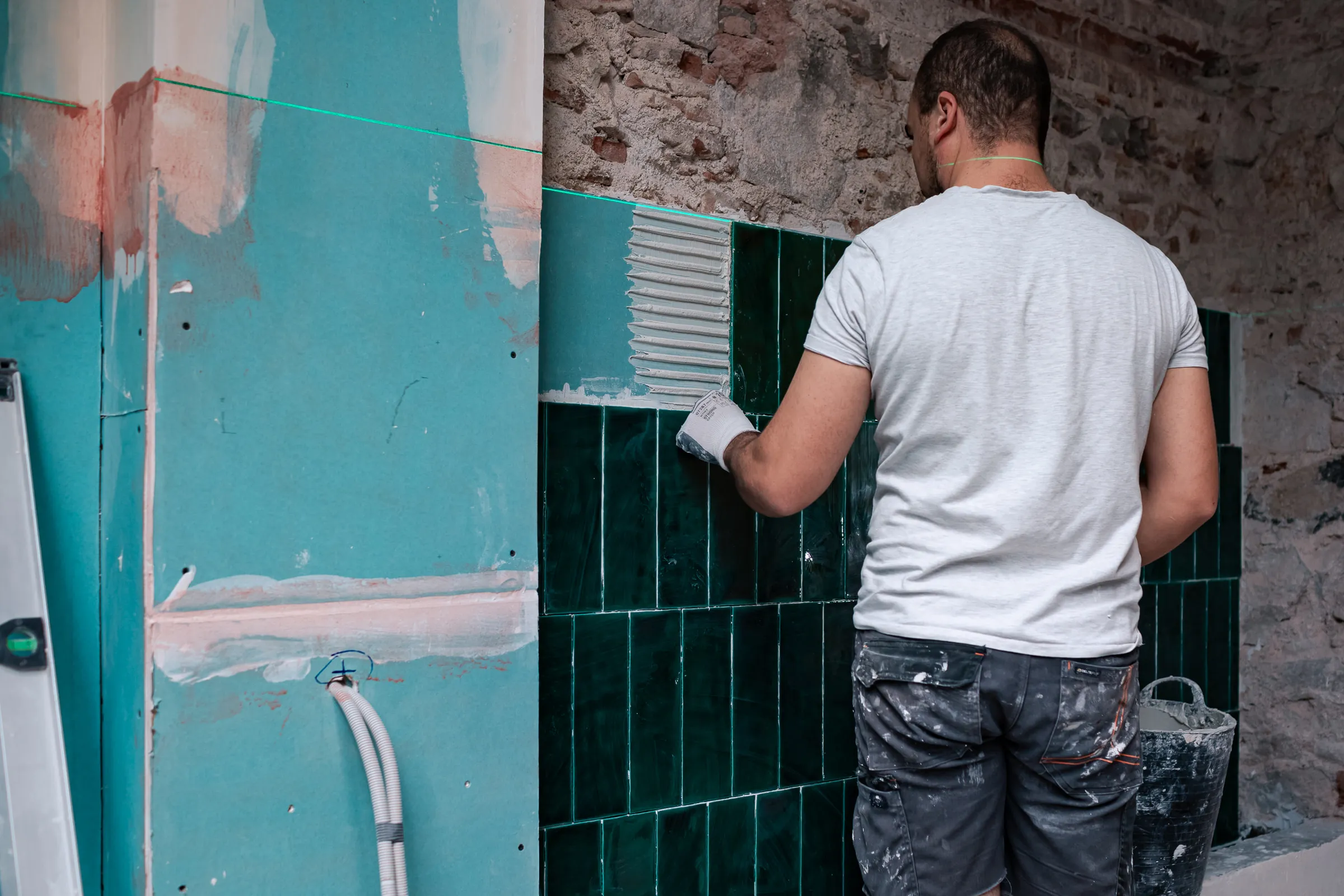 Glazed tile installation in progress