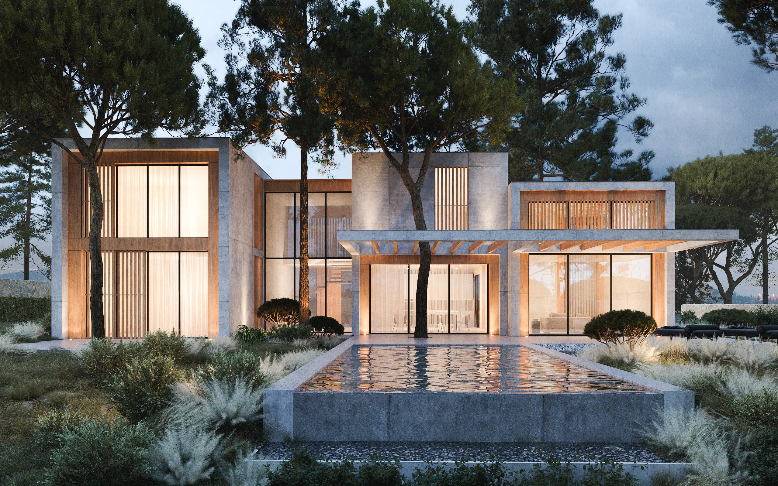 Frontal view of the house in Sant Andreu de Llavaneras, with an infinity pool reflecting the centenary pines