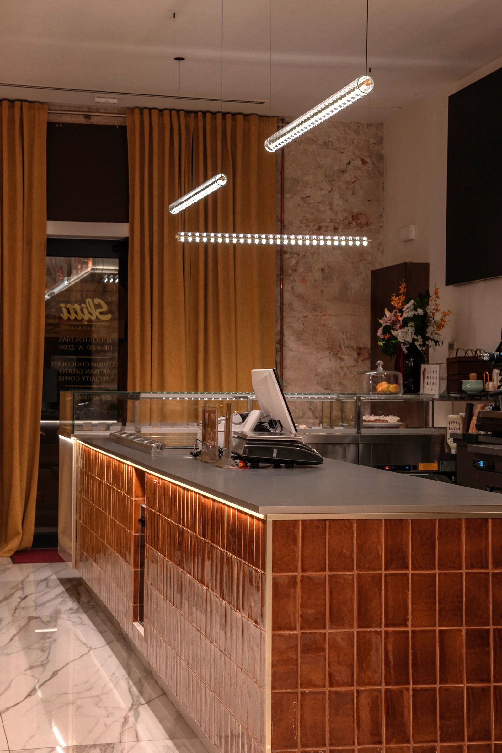 Counter area with the warm, layered palette of the project