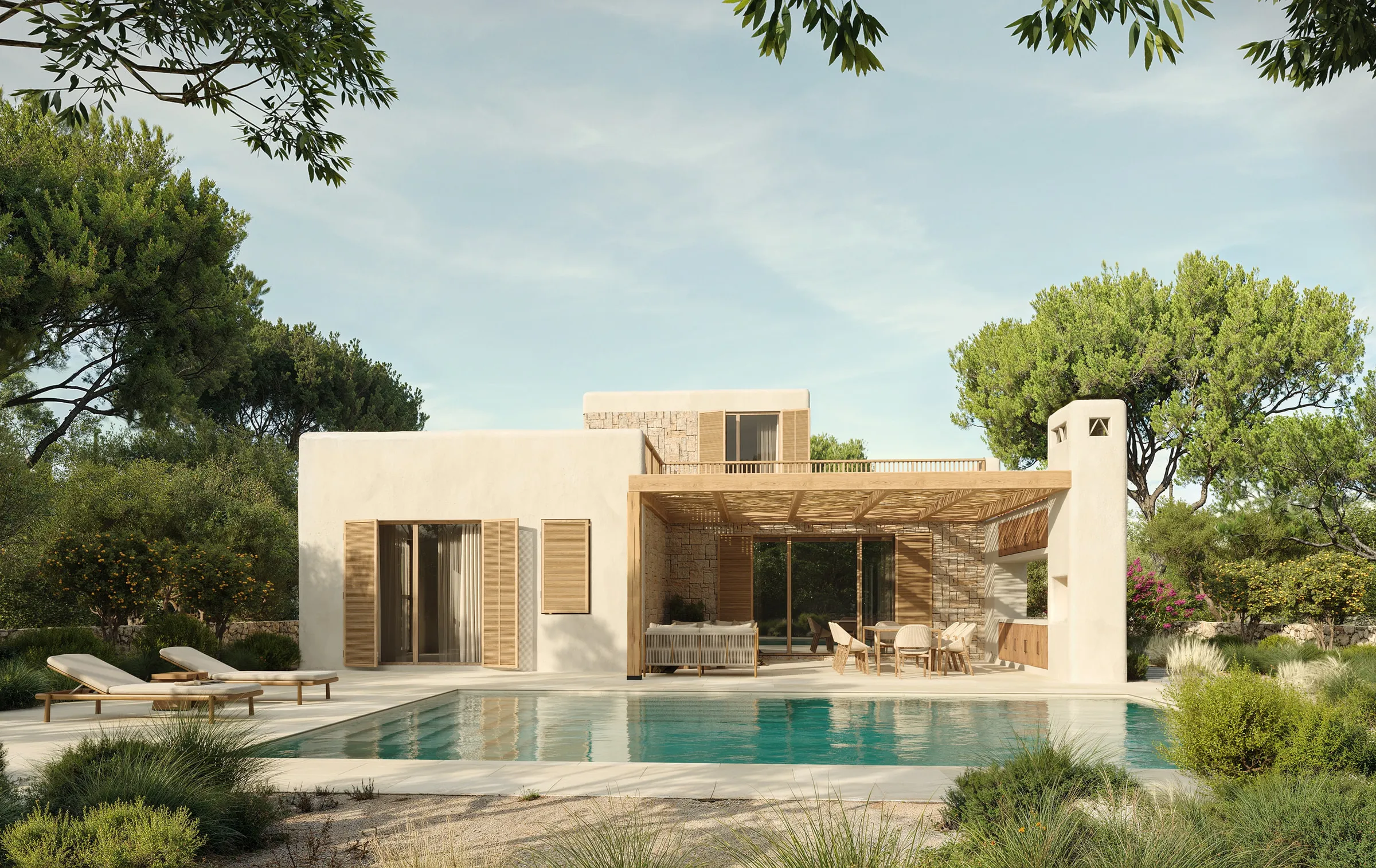 The villa seen from the garden, surrounded by native Mediterranean vegetation