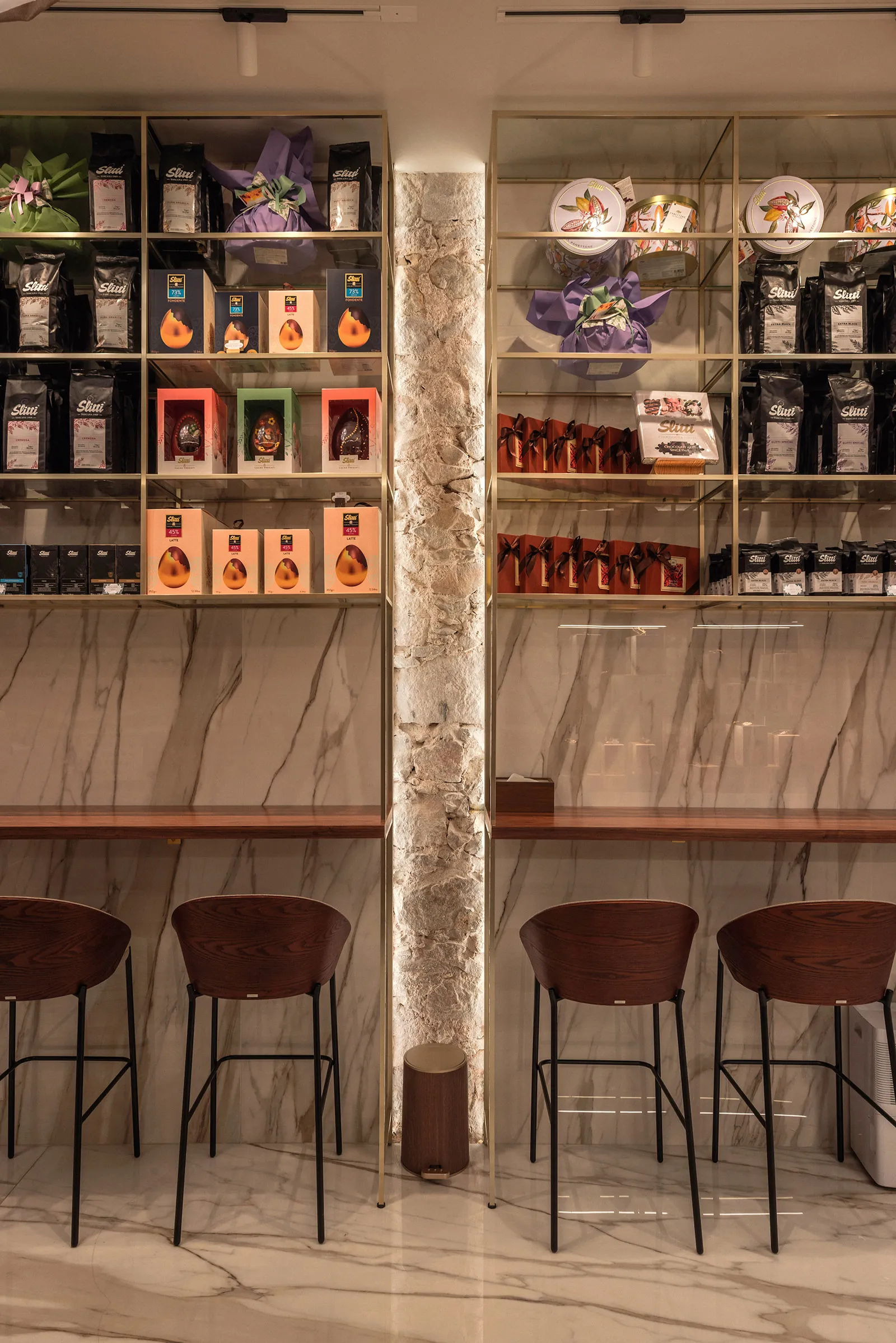 Shelves with a high tasting bar in front